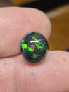 6 Carat Australian Black Opal in a 4-Prong White Gold Mounting