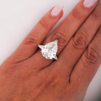 GIA Certified 7.03 Carat Pear Cut F/SI2 Diamond Platinum 3 Stone Ring – Assay Jewelers