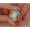 GIA Certified 8 Carat White Opal With Orange Garnet & Aquamarine Halo Ring